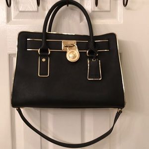 Black and gold Michael Kors bag